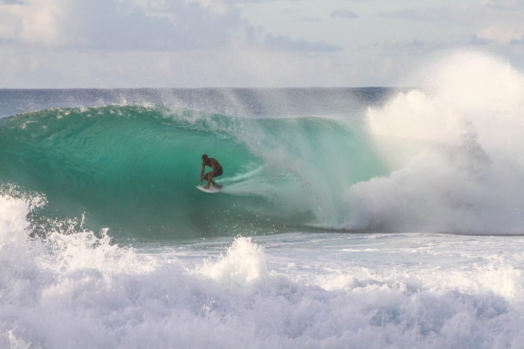 surfer in turquoise water