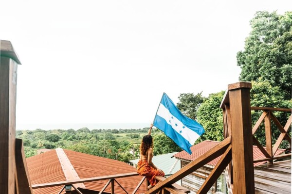 woman waving flag in Honduras