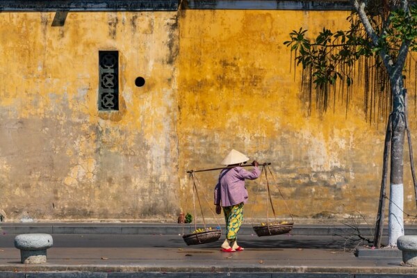 Vietnamese person walking in Hoi An